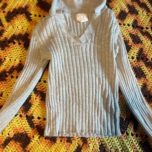 This is a cropped gray shirt with a collar.